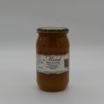 Obrazek przedstawia słoik o wadze 1,1kg w kolorze karmelu na białym tle.