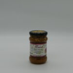 Słoik ciemnego miodu wrzosowego na naturalnym tle, podkreślający intensywny smak i bogactwo składników odżywczych